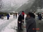 [...snowball fight, near Homer Tunnel (driver is explaining snow, and snowballs,  to some young folks from India)]