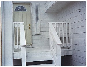 [25 September: The front porch with its primer coat.  Ready for the final color!]