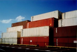 [April 12, 1999: Our household goods are in this stack somewhere. (Photo taken at Kahului-Maui Harbor.)] style=