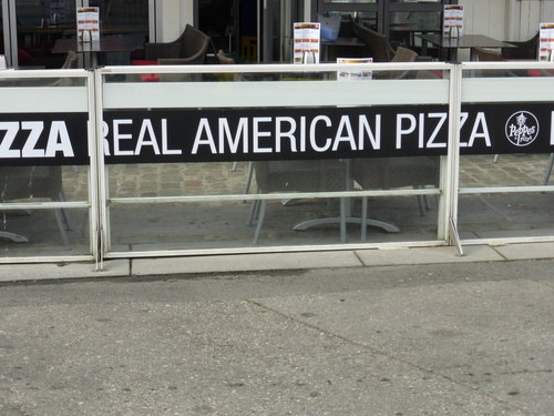 Pizza offered as 'Real American' in the inner harbor area of Bergen, Norway (and we thought pizza was Italian...)