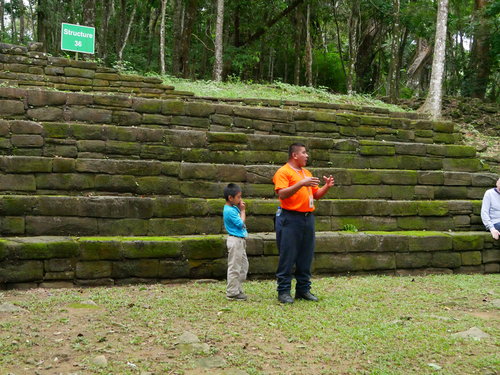 [Local Guide with His Son at the Maya Ruins]
